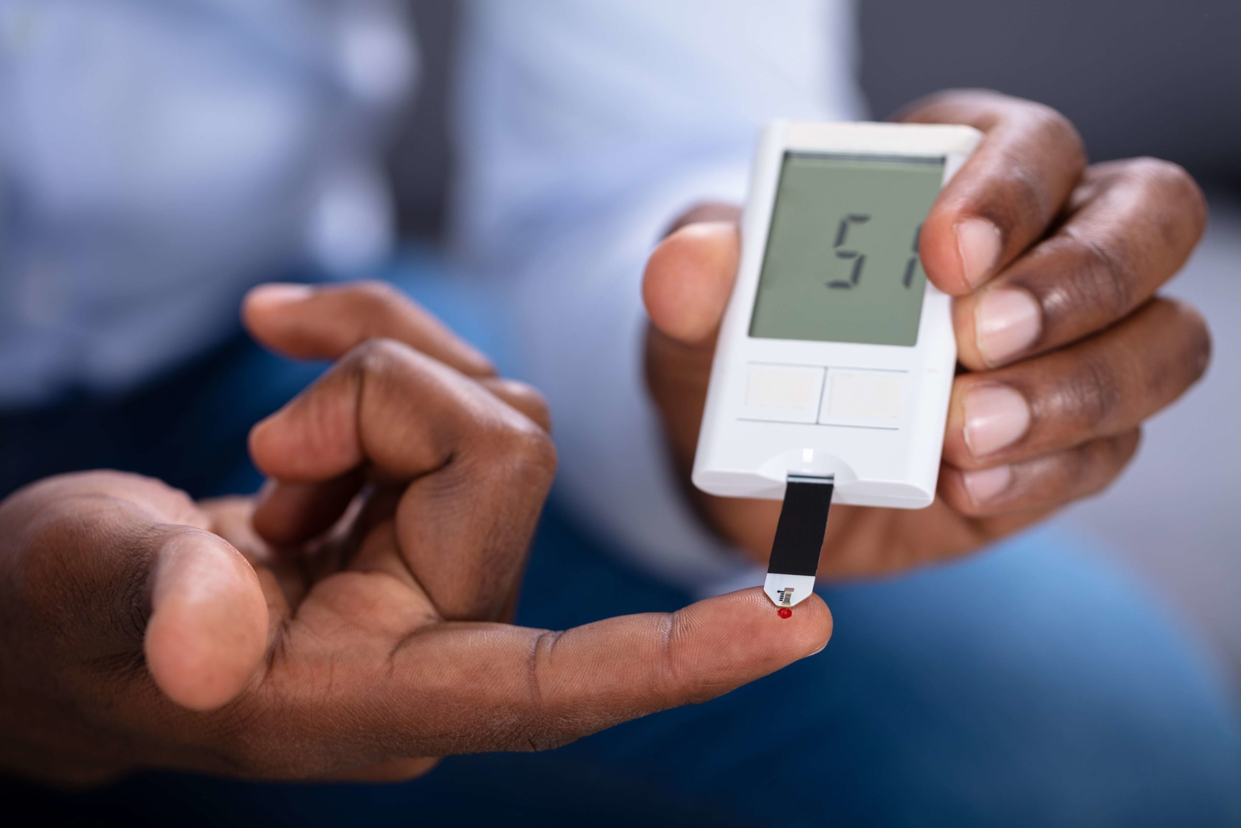 African American Person Taking Blood Sample