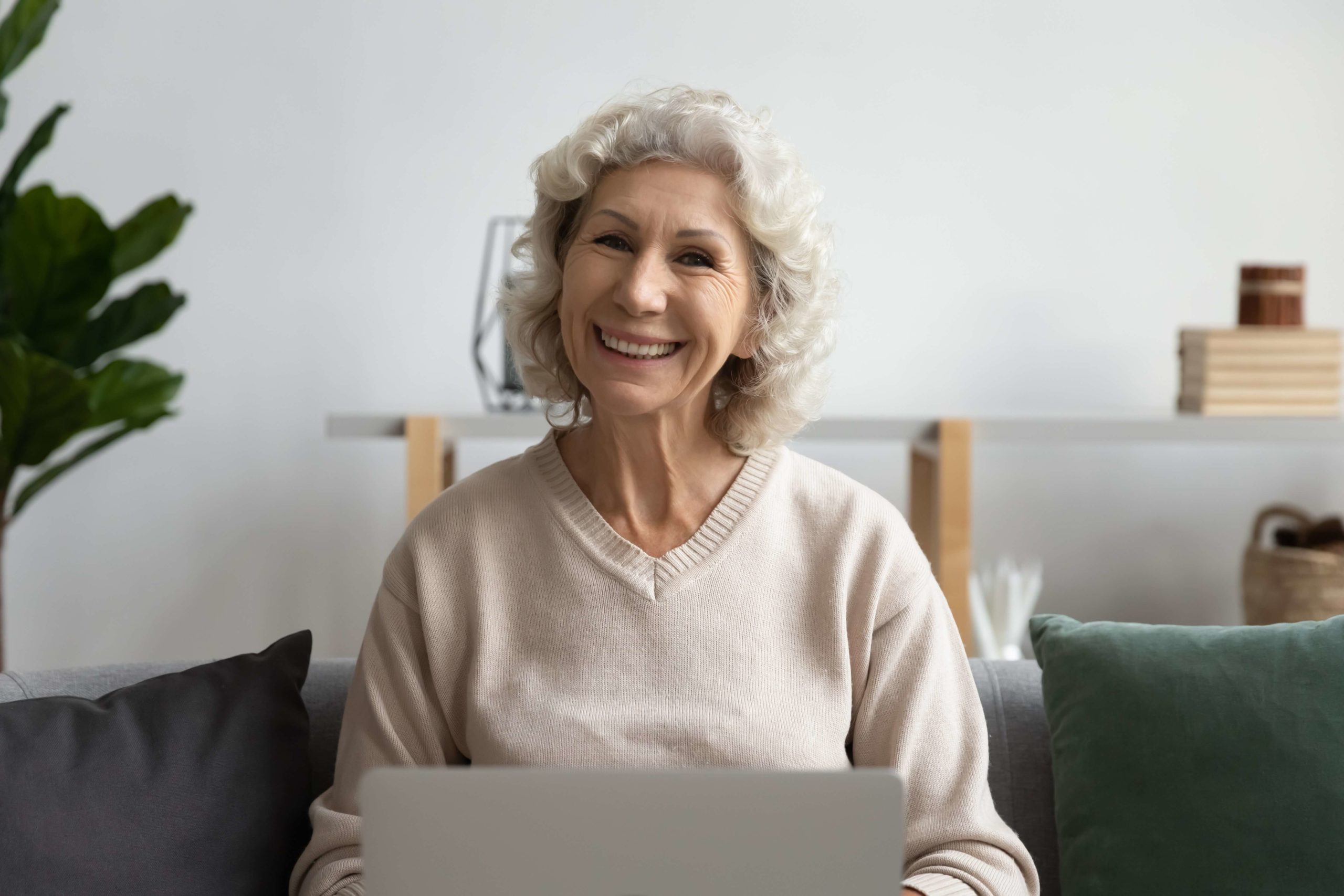 smiling elderly woman on laptop (1)