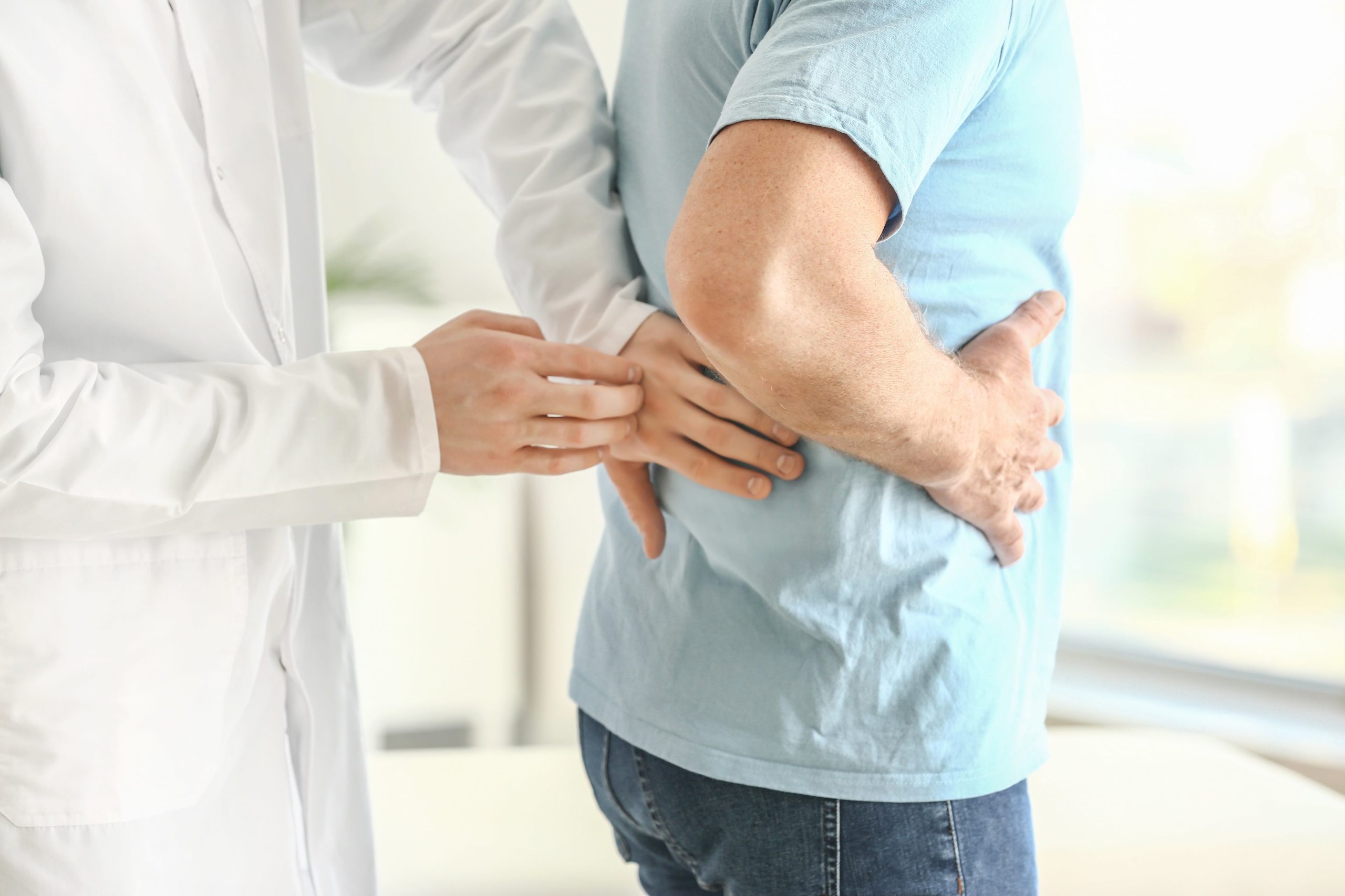 Doctor examining a patient with kidney disease